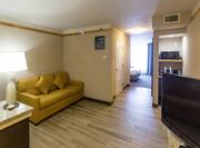 Suite Living Area with Sofa, Television, Microwave and Entry to Bedroom