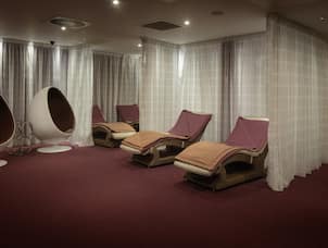 Spa Treatment Area with Lounge Chairs and Pods