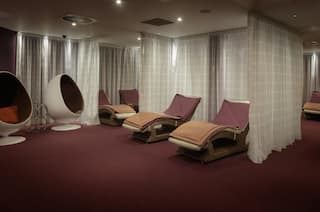 Spa Treatment Area with Lounge Chairs and Pods