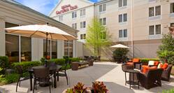 Outdoor patio seating and hotel exterior 