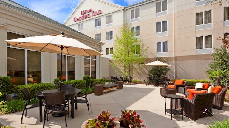 Outdoor patio seating and hotel exterior 