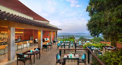 Feliz restaurant patio tables and scenic views. 