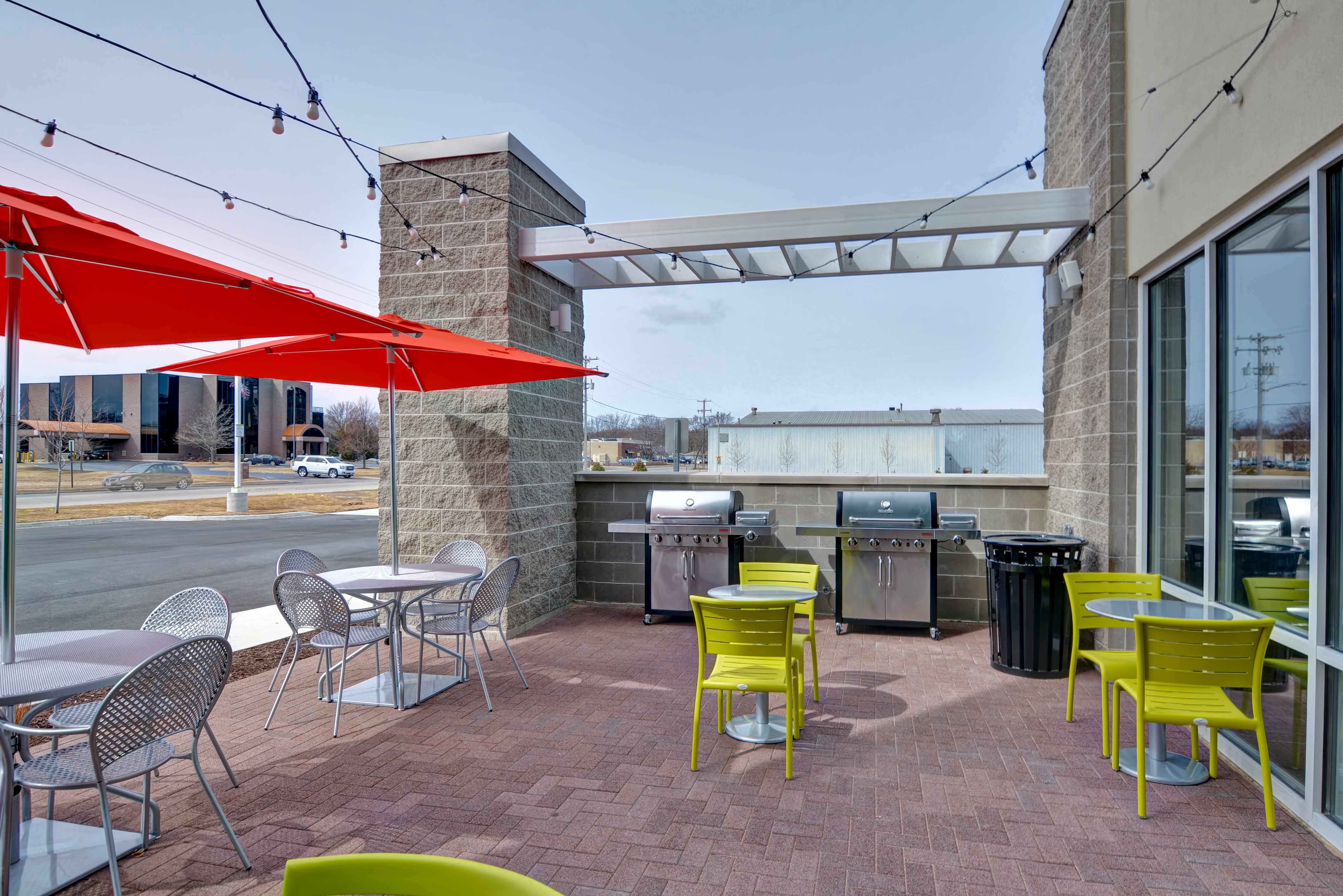 Outdoor Patio with Tables, Chairs and Grills