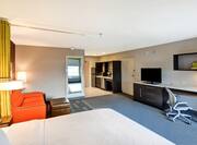 Guestroom with Bed, Work Desk, Television, Sofa and Entrance