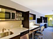 King Suite with Kitchen, Work Desk, Television and Bed