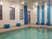 Indoor Pool and With Blue Seats and Windows