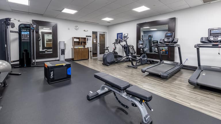 on site fitness center, weight bench, treadmills