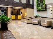 Lobby of the Hilton Garden Inn Guatemala City with seating and front desk