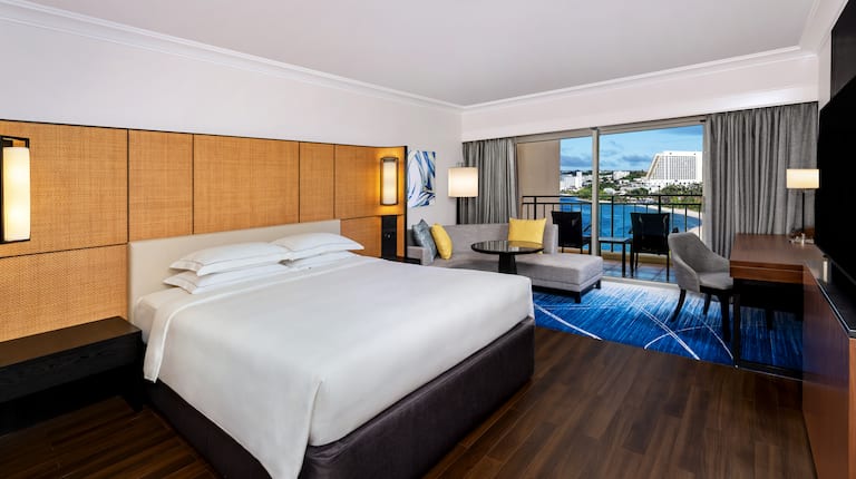 Large Bed in a Guest Room with Balcony