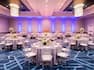 Ballroom with Linen Covered tables with Floral Centerpieces