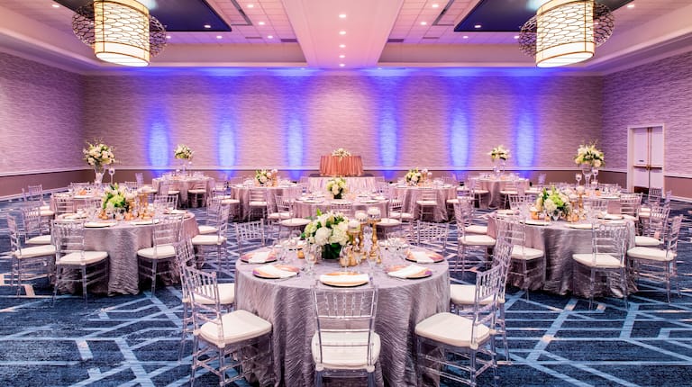 Ballroom with Linen Covered tables with Floral Centerpieces