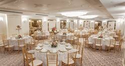 Meeting Room Wedding Reception Setup with Round Tables and Chairs