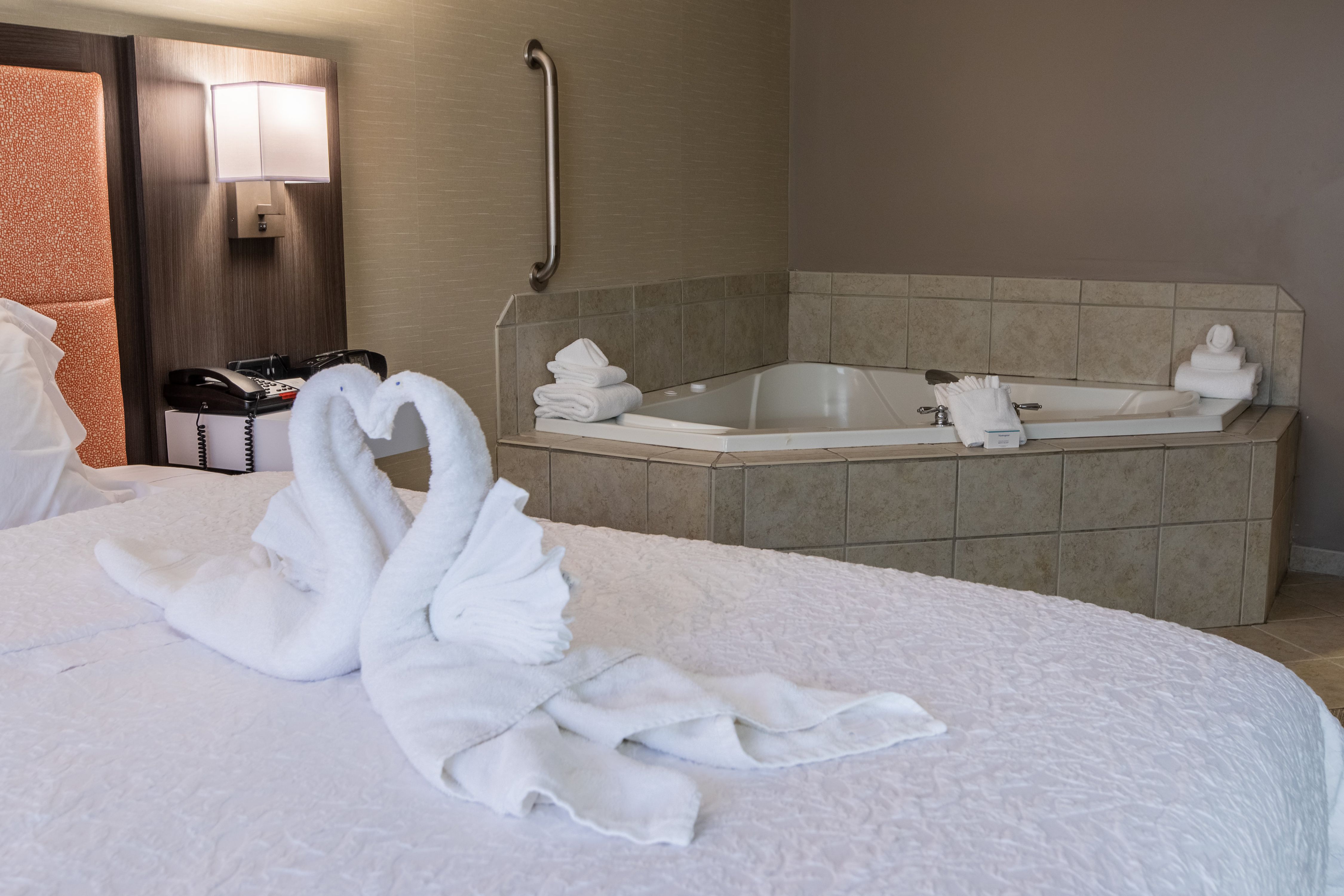 King bed with whirlpool and towels