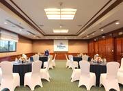 Spacious Meeting Room with Round Table Set Up