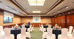 Spacious Meeting Room with Round Table Set Up