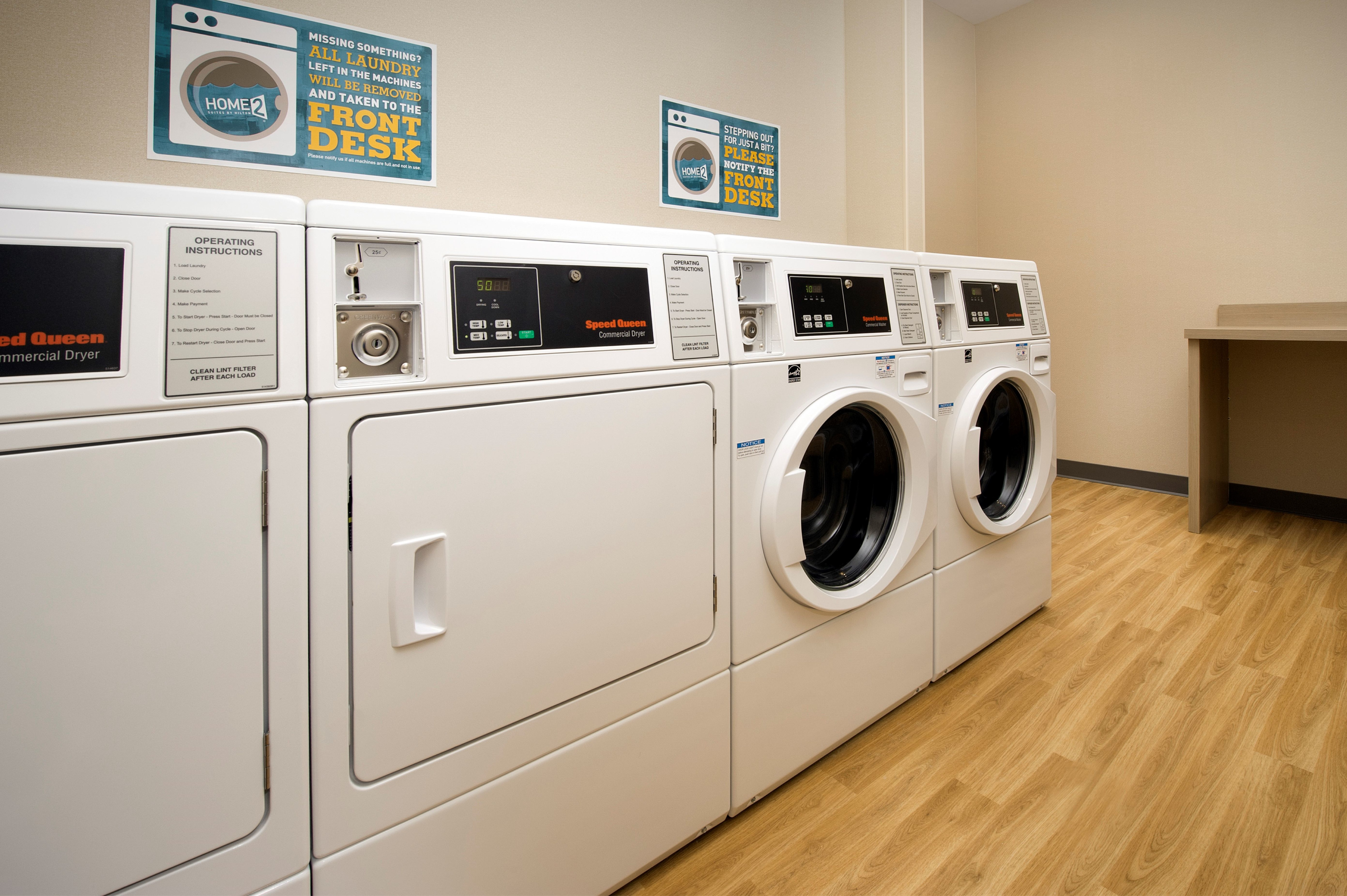 Laundry room dryers, washing machines and folding table