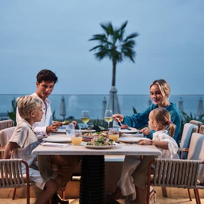 Family Dining on the Terrace of Gea Restaurant with Sea View