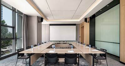 Meeting room with square shaped table setup