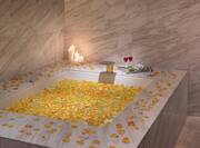Romantic Setting at the Spa with Candles and Rose Petals