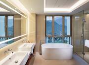 Bathtub and Dual Vanity Area in Suite