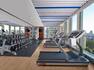 Fitness center with treadmills and free weights area