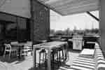 Outdoor grill area with seating and tables