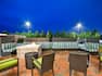 Outdoor Patio Seating Area with Firepit at Night