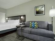 King Bed and Lounge Area in Whirlpool Suite
