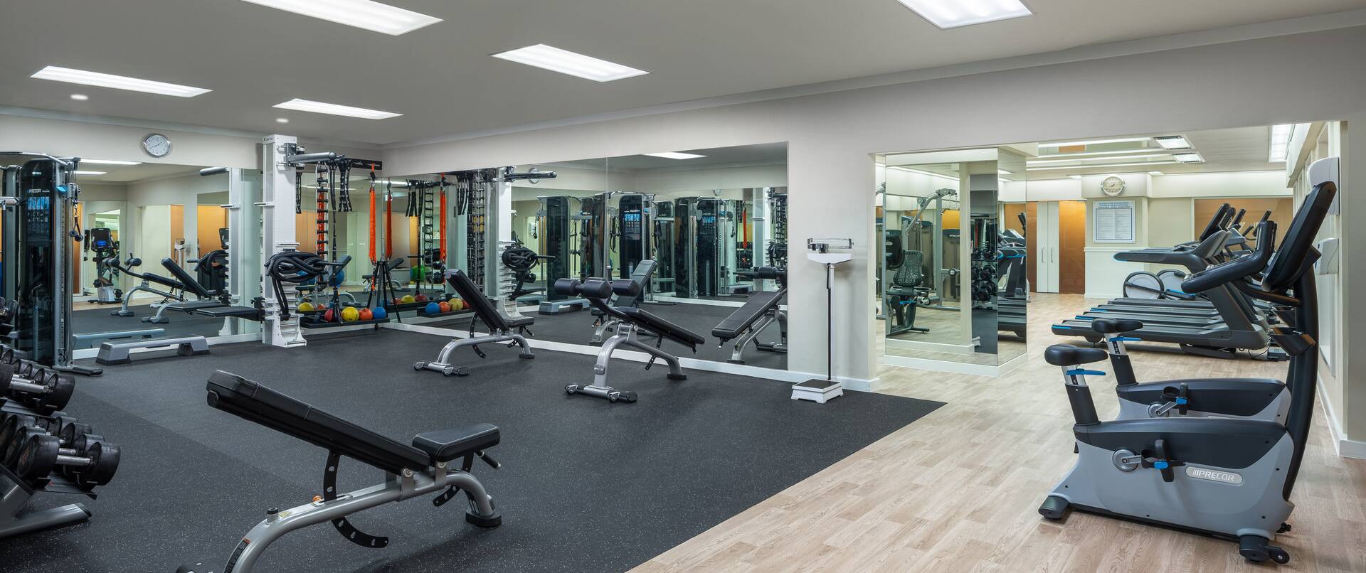 Fitness center with benches and mirrors