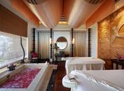 Spa with treatment tables and petals