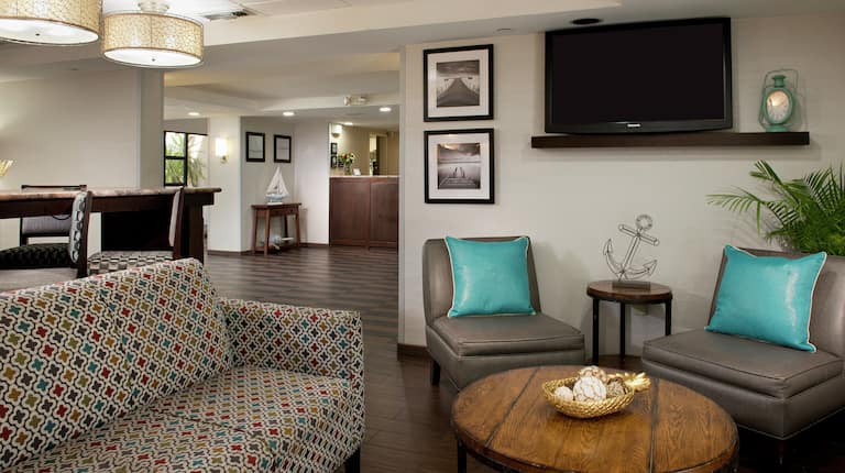 Lobby area with comfortable seating and TV
