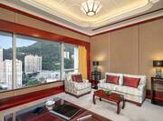 Sitting Area of King Imperial Suite with City View from Large Window