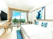 King premium room with wall mounted TV and balcony