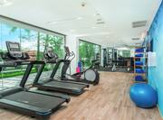 Fitness center with treadmills and free weights