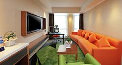 King Business Suite Living Area with Lounge Furniture, Work Desk, and TV