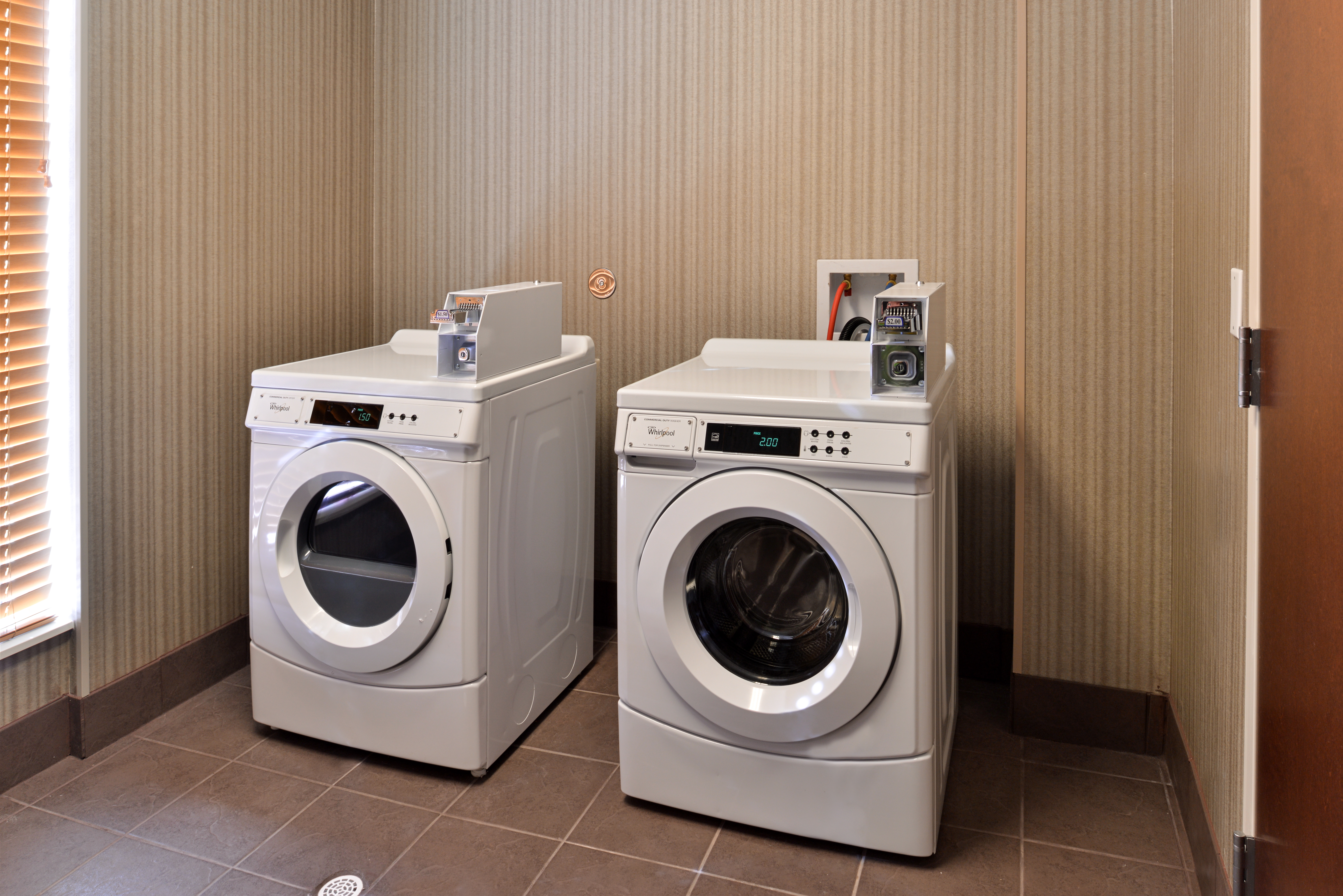 Laundry Room With Coin Operated Washing and Drying Machines