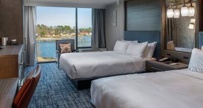 Guest Room with Two Beds and Water View