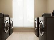 Laundry room facilities with washers and dryers