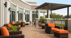 Outdoor Seating Area on Patio with Pergola and lounge chairs