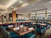 Restaurant dining area with tables, chairs, and dining amenities