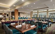 Restaurant dining area with tables, chairs, and dining amenities