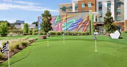 Putting Green On-Site with Hotel Exterior