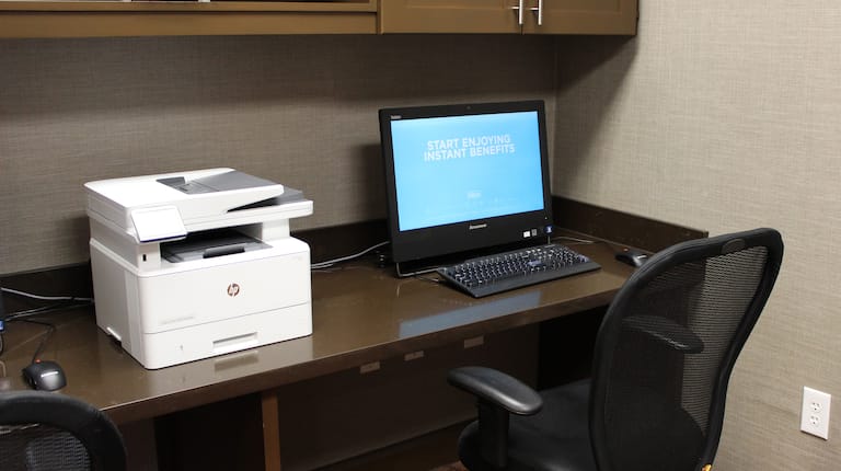 Detailed View of Printer and Computer Workstation in Business Center