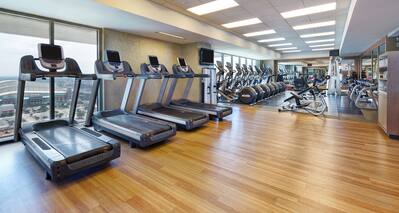 Fitness Center with Treadmills and Cross-Trainer Machines