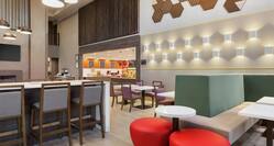 Spacious breakfast area featuring comfortable seating, complimentary buffet, and stylish design.