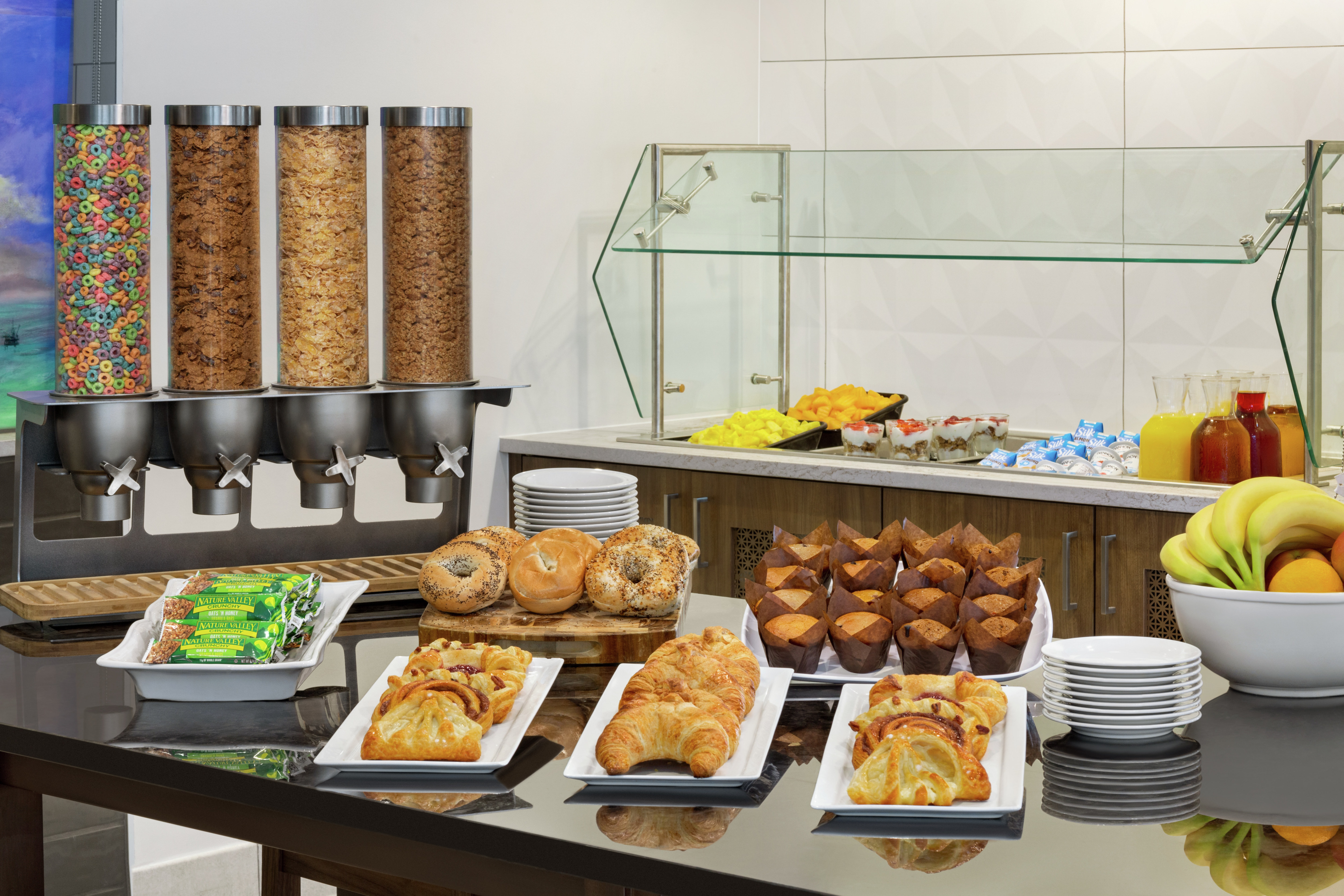 Daily complimentary breakfast buffet overflowing with delicious food and beverages for guests to enjoy.