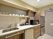 Suite Kitchen with Sink and Room Technology