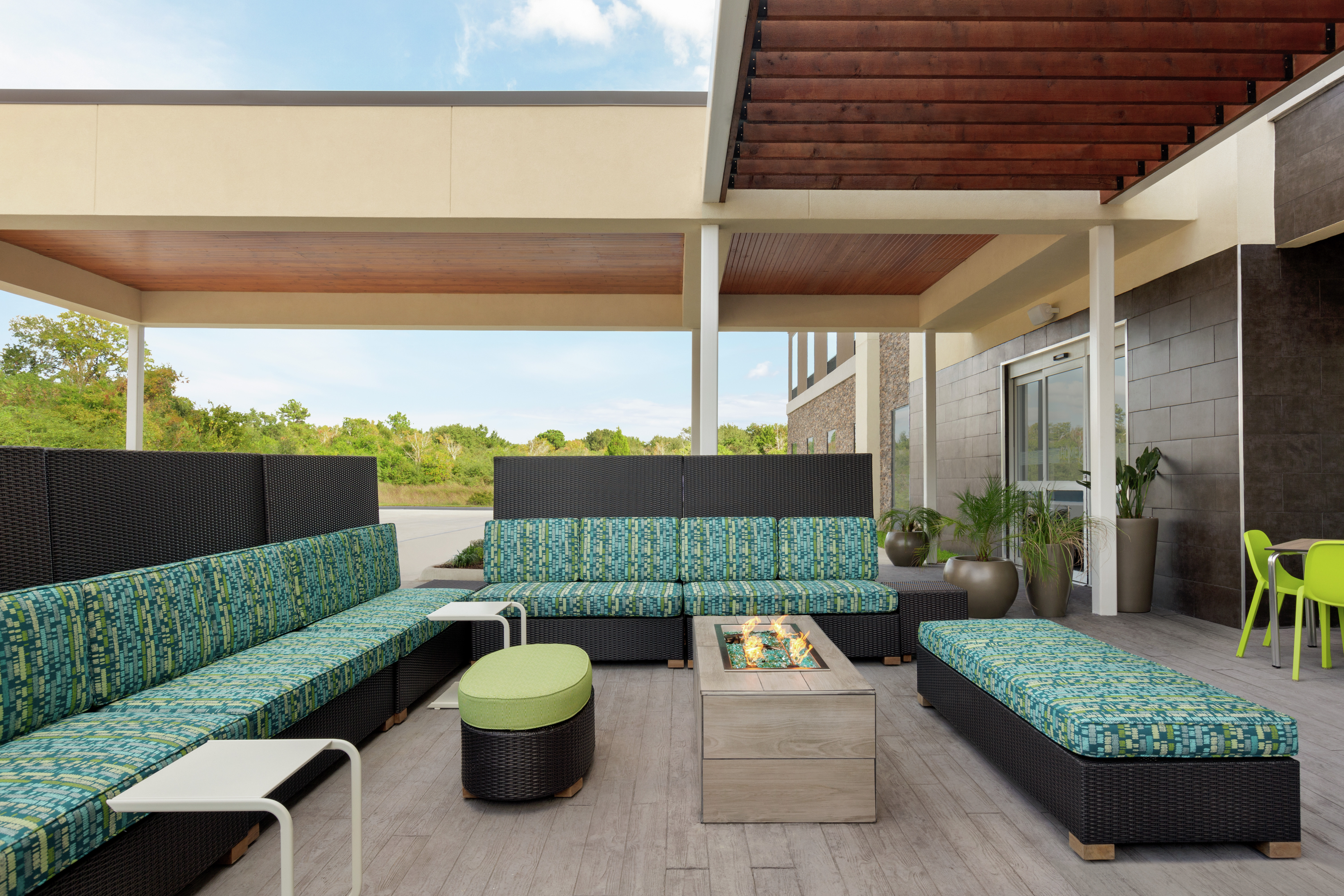 Outdoor lounge area for guests to relax with comfortable sofa style seating and firepit.