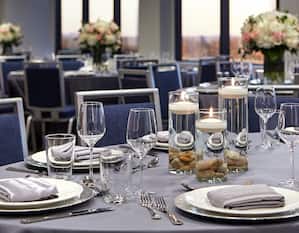 Close up of glassware and place settings on a dining table