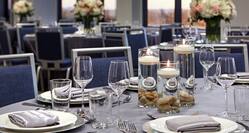 Close up of glassware and place settings on a dining table